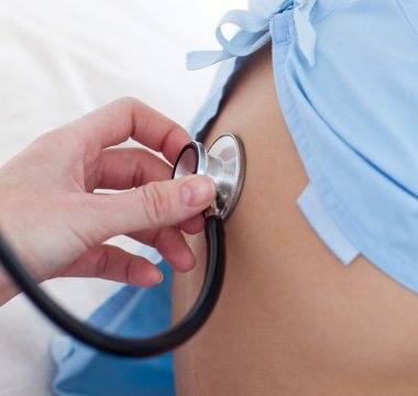 Close-up of a doctor checking a child's respiratory rate clipart