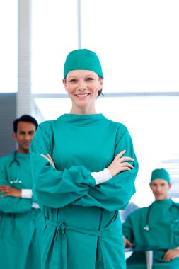 A group of doctors wearing surgical gown clipart