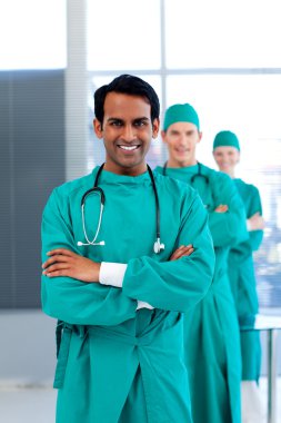 Multi-ethnic surgeons standing in a row clipart