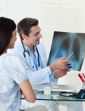 Doctors analyzing an x-ray clipart