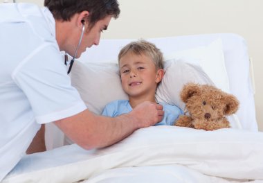 Doctor listening to a child breaht with stethoscope clipart