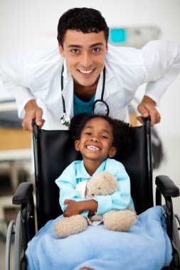 Young child being cared for by a doctor clipart