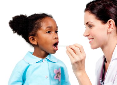 Smiling doctor taking little girl's temperature clipart