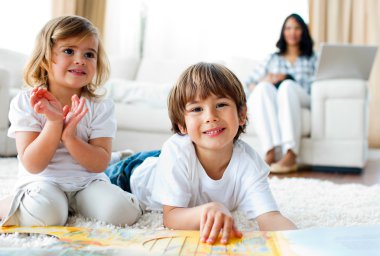 Jolly siblings eating chips and drawing clipart