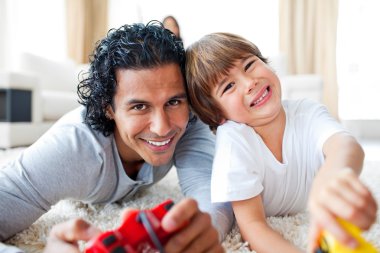 Animated little boy and his father playing video games clipart