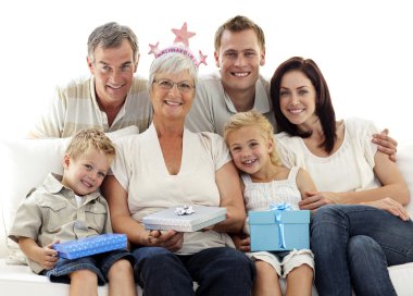 Family celebrating grandmother's birthday clipart