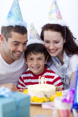 Little boy celebrating his birthday with his family clipart