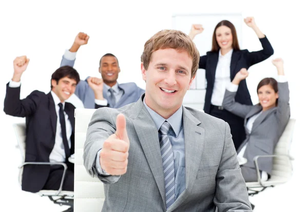 Fortunate business team punching the air — Stock Photo, Image