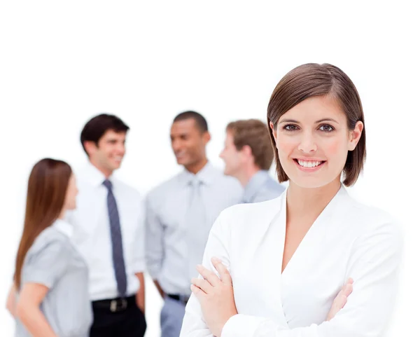 Confident manager in front of her team with folded arms — Stock Photo, Image