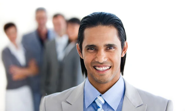 Charismatic businessman in front of his team — Stock Photo, Image