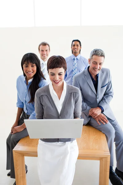 Multi-ethnic business team using a laptop — Stock Photo, Image