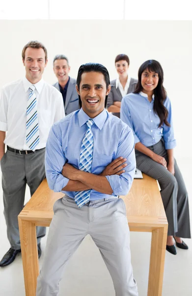 Cheerful International Business partners standing around a table — Stock Photo, Image