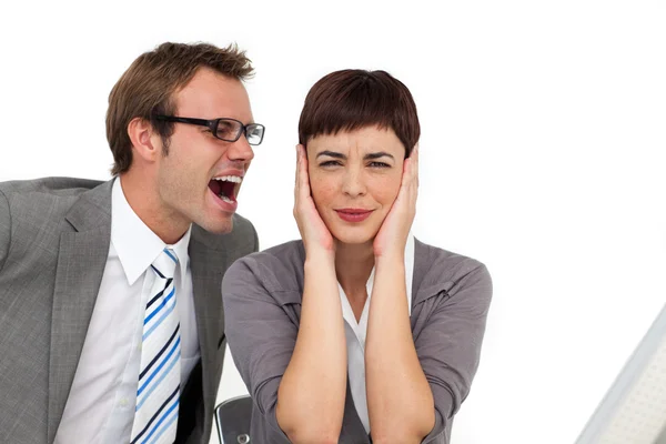 Hombre de negocios estresado gritando en el oído de su colega —  Fotos de Stock