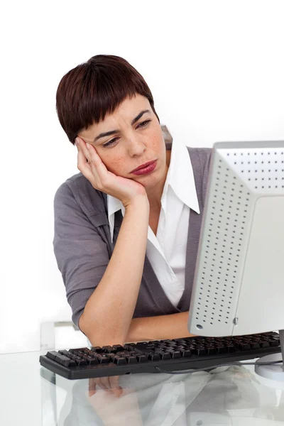Bored young businesswoman at her desk — Stock Photo, Image