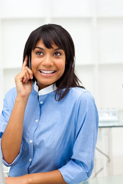 Glowing ethnic businesswoman on phone — Stock Photo, Image
