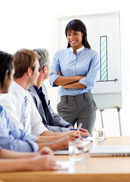 Self-assured businesswoman presenting to her team — Stock Photo, Image