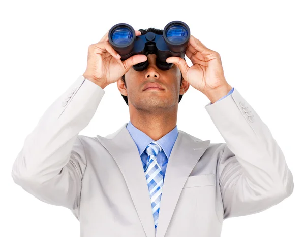 Serious businessman using binoculars — Stock Photo, Image
