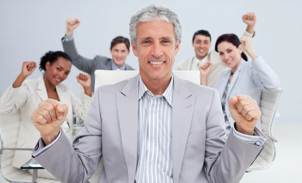 Happy businessman celebrating a sucess with his team — Stock Photo, Image