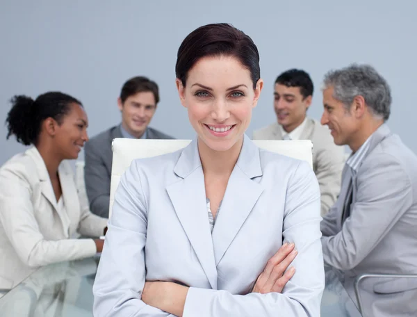 Close-up of happy businesswoman smiling in a meeting — Stock Photo, Image