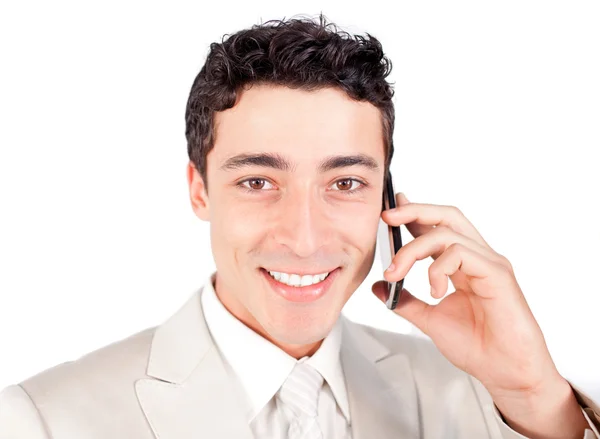Attractive ethnic businessman talking on phone — Stock Photo, Image