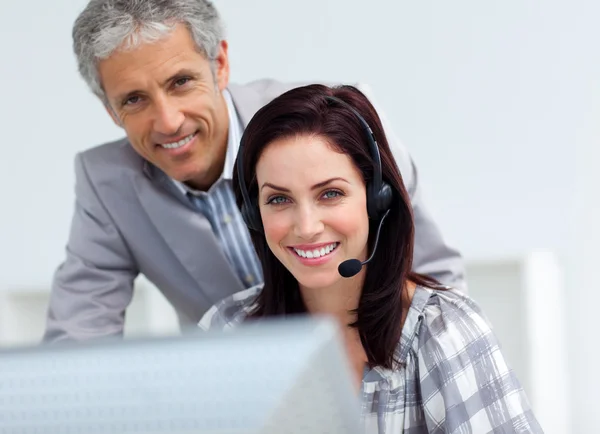 Mature businessman helping his colleague — Stock Photo, Image