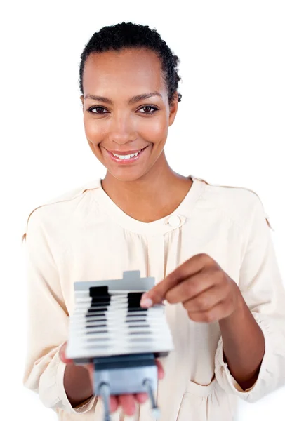 Self-assured businesswoman consulting a business card holder — Stock Photo, Image