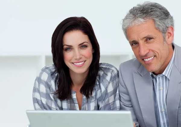 Cheerful business working at a computer — Stock Photo, Image