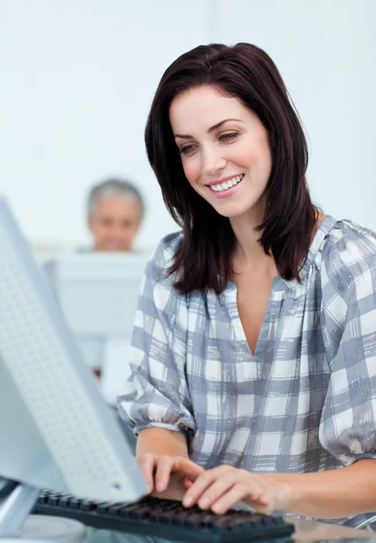 Charming businesswoman working at a computer — Stock Photo, Image