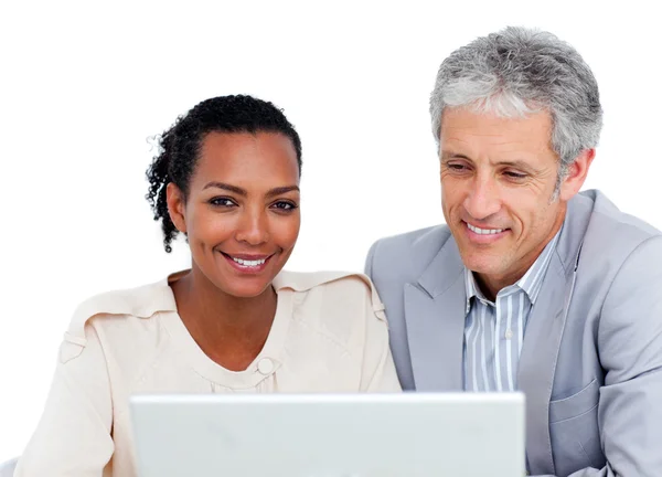 Multi-ethnic business co-workers using a laptop — Stock Photo, Image