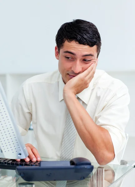 Bored young businessman at his desk — Stock Photo, Image