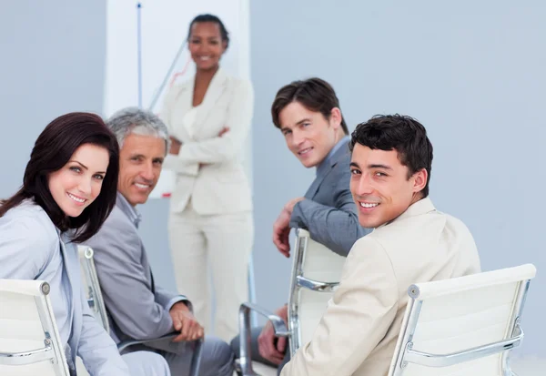 Smiling international business at a presentation — Stock Photo, Image