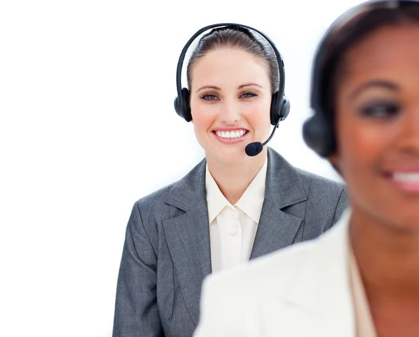 Portrait of young businesswoman and her colleague with headset o — Stock Photo, Image