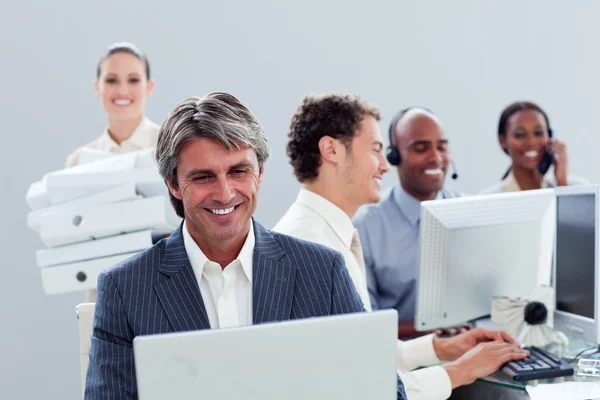 Portrait of a smiling business team at work — Stock Photo, Image