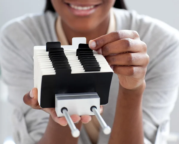 stock image Close-up of an Afro-american businesswoman searching for the ind