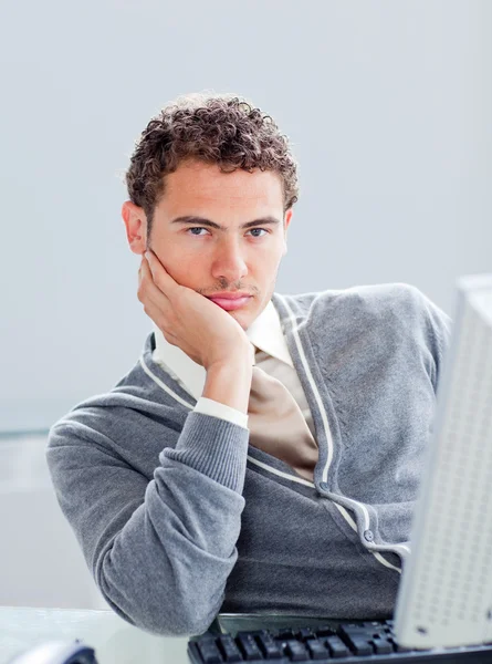 Portrait of a young businessman getting bored at work — Stock Photo, Image