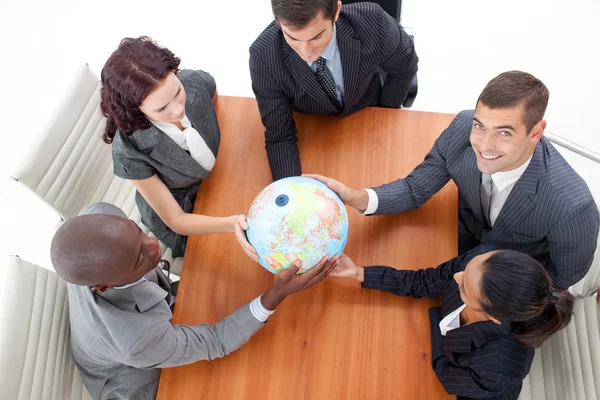 High Angle of businessteam holding a globe and businessman smili — Stock Photo, Image