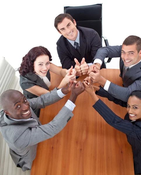 Negócio feliz com polegares para cima em uma reunião — Fotografia de Stock