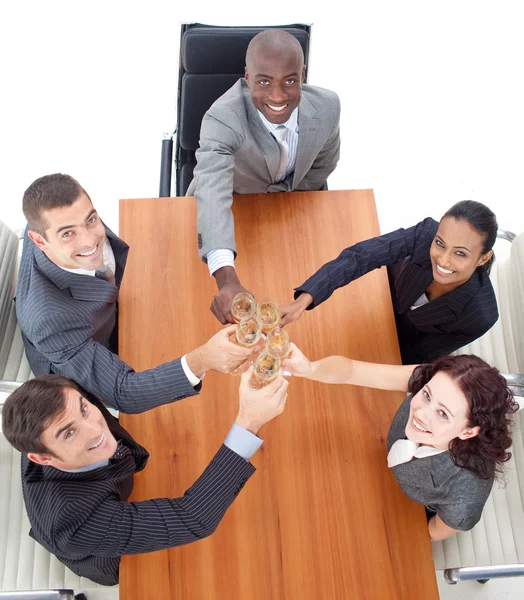 Smiling business team celebrating a success with champagne — Stock Photo, Image