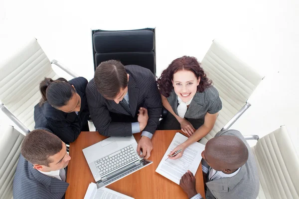 High angle of smiling businesswoman working with her team — Stock Photo, Image