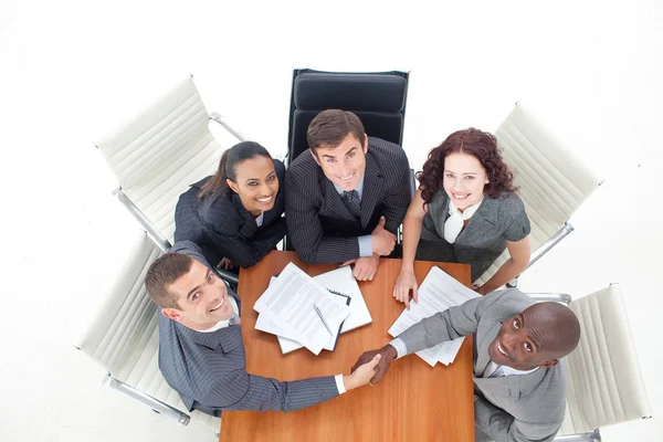 High angle of businessmen shaking hands in office — Stock Photo, Image