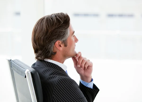 Pensive male executive sitting in his office — Stock Photo, Image