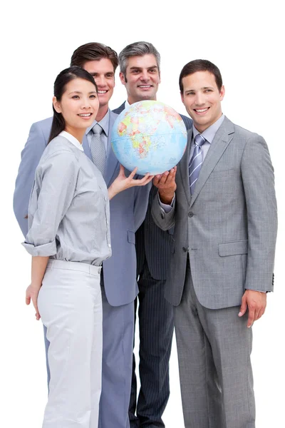 Framgångsrika businessteam titta på en terrestrial globe — Stockfoto