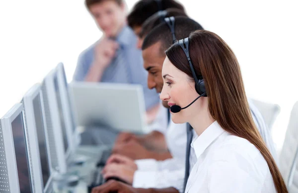 Smiling business team working in a call center — Stock Photo, Image
