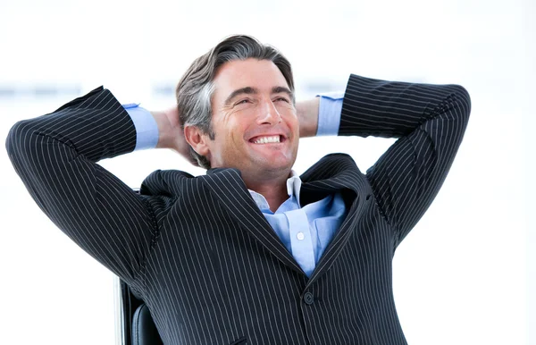 Laughing male executive thinking about his success — Stock Photo, Image