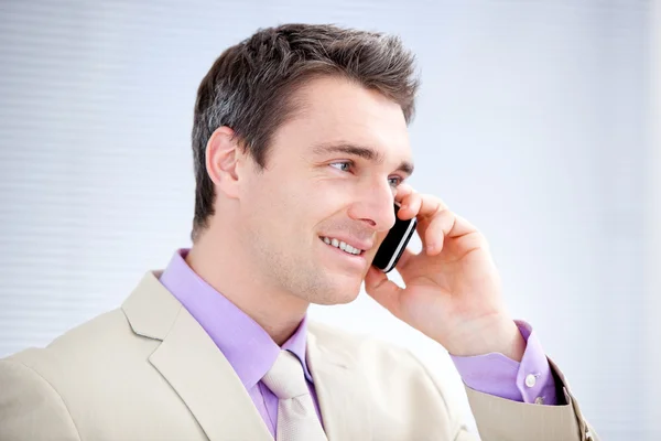 Positive businessman talking on phone — Stock Photo, Image