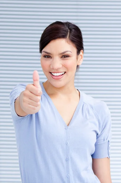 Cheerful businesswoman with a thumb up — Stock Photo, Image