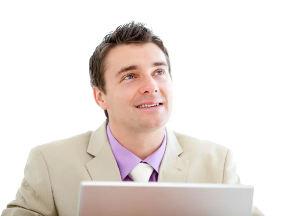 Pensive businessman using a laptop — Stock Photo, Image