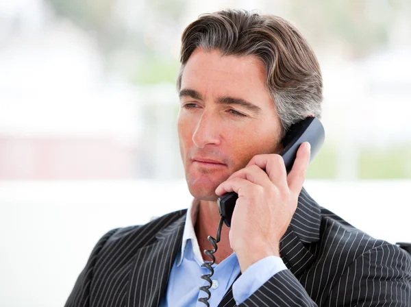 Portrait of a self-assured businessman on phone — Stock Photo, Image
