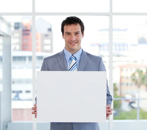 Portrait of a male manager holding a white board — Stock Photo, Image