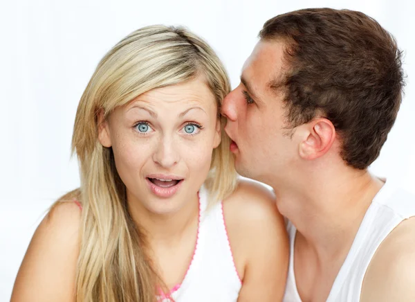 Man telling a woman a secret — Stock Photo, Image